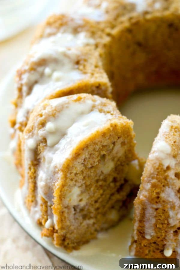Simple Big-Batch Stovetop Applesauce 11 A beautifully glazed Fresh Apple Bundt Cake, showcasing its moist interior with soft apple chunks, ideal for fall desserts.
