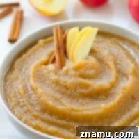 Simple Big-Batch Stovetop Applesauce 9 A bowl of lightly spiced stovetop applesauce, a perfect fall comfort food, ready to be enjoyed.
