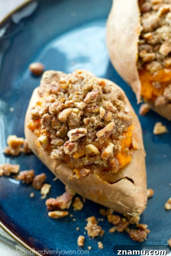 Creamy Twice-Baked Sweet Potatoes with Crunchy Pecan Streusel 2 Close-up of golden-brown twice-baked sweet potatoes with pecan streusel topping, ready for Thanksgiving dinner.
