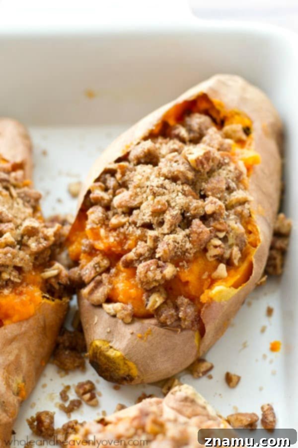 Creamy Twice-Baked Sweet Potatoes with Crunchy Pecan Streusel 6 Overhead shot of freshly baked twice-baked sweet potatoes topped with streusel, served in their skins.