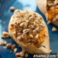 Creamy Twice-Baked Sweet Potatoes with Crunchy Pecan Streusel 9 A small image of a fully prepared twice-baked sweet potato, perfect for a recipe thumbnail.