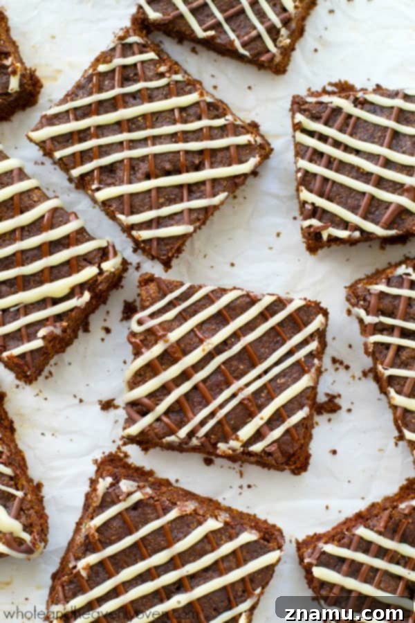 Decadent Triple Chocolate Chewy Bars 4 Deliciously soft and chewy triple chocolate cookie bars, featuring rich layers of chocolate and a perfect texture. An ultimate treat for chocolate lovers. @WholeHeavenly