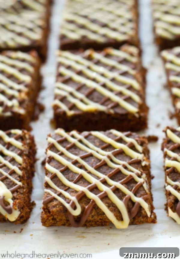 Decadent Triple Chocolate Chewy Bars 5 Three kinds of chocolate blend perfectly in these soft and chewy cookie bars, creating a rich and delightful experience. Ideal for satisfying any chocolate craving. @WholeHeavenly