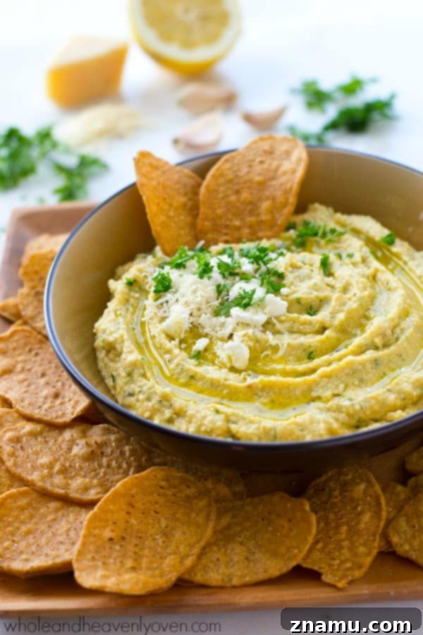 Richly Herbed Hummus with Roasted Garlic and Three Cheeses 2 A trio of cheeses, homemade roasted garlic, and fresh herbs star in this super-easy and unbelievably smooth hummus.---It's the perfect dip for any holiday appetizer table! @WholeHeavenly