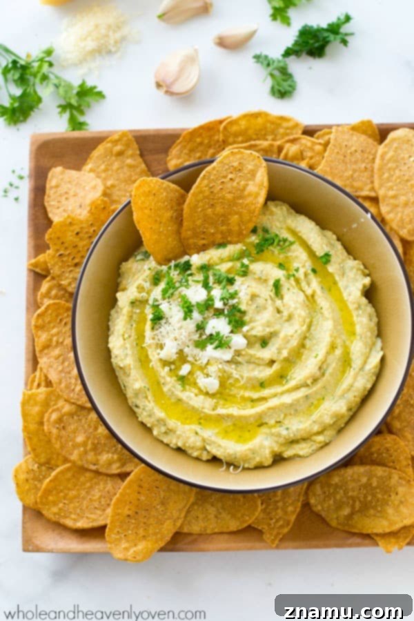 Richly Herbed Hummus with Roasted Garlic and Three Cheeses 3 A trio of cheeses, homemade roasted garlic, and fresh herbs star in this super-easy and unbelievably smooth hummus.---It's the perfect dip for any holiday appetizer table! @WholeHeavenly