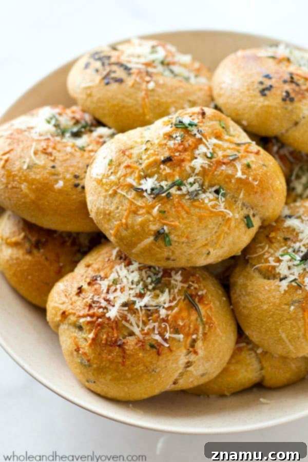 Garlic Rosemary Parmesan Knots 2 Warm, golden Parmesan Garlic Rosemary Rolls ready for your Thanksgiving table. These soft knots are infused with aromatic rosemary and savory garlic.