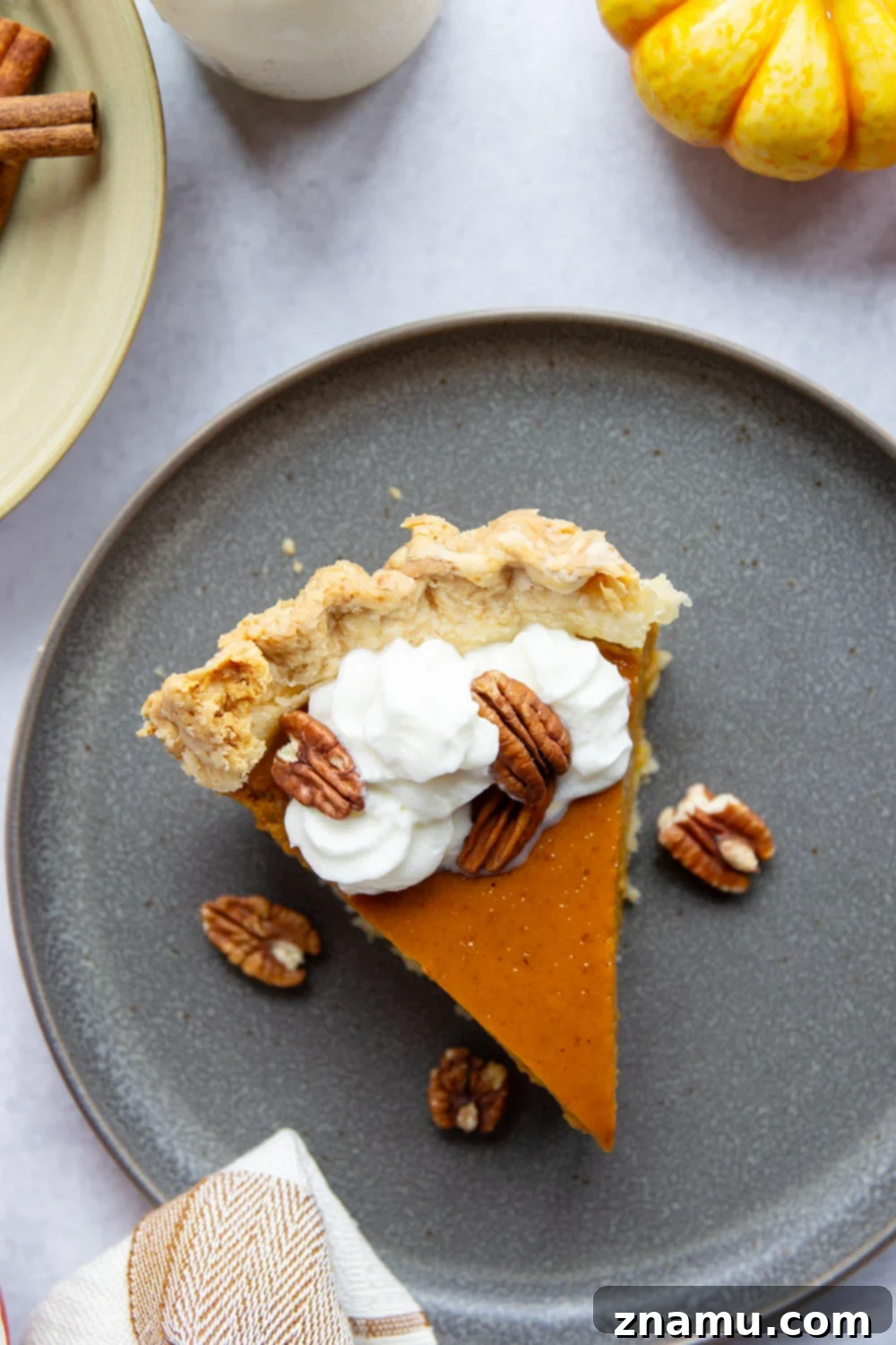 The Ultimate Pumpkin Pie 2 The Best Classic Pumpkin Pie with a flaky crust and silky smooth filling, topped with homemade whipped cream.