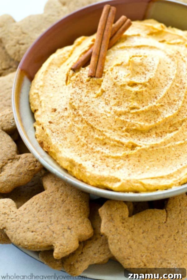 Spiced Pumpkin Cheesecake Dip with Zesty Gingersnap Dippers 7 Pile of crispy, golden-brown turkey-shaped gingersnap cookies, ready to be paired with dip. A fun and delicious holiday treat. @WholeHeavenly