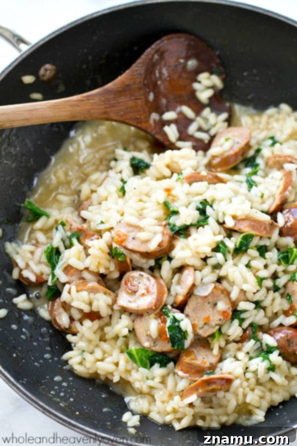 One-Pot Parmesan Risotto with Sausage and Kale 6 A close-up shot of the finished One-Pot Parmesan Risotto, highlighting its creamy texture and the vibrant ingredients.