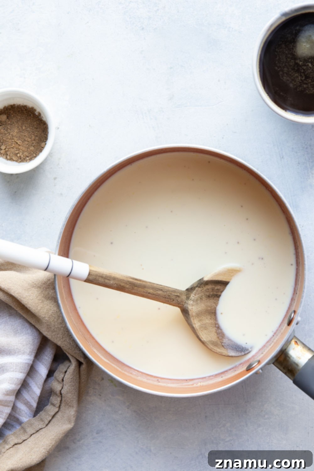 Spiced Eggnog Coffee Delight 3 Homemade eggnog coffee creamer in a glass bottle, perfect for a holiday treat or gift.