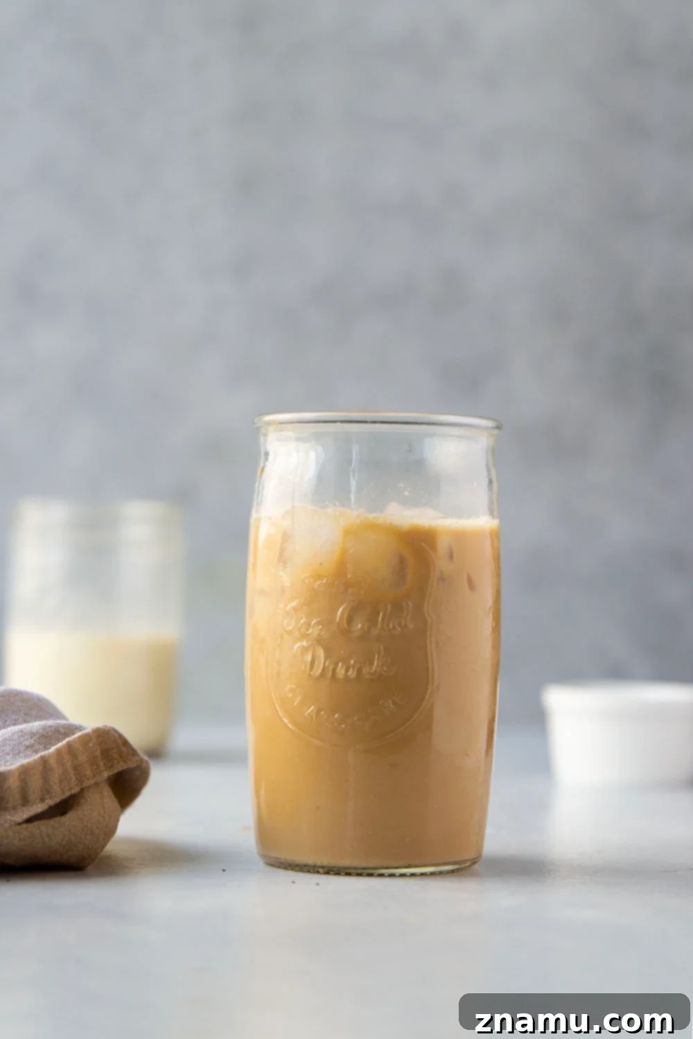 Spiced Eggnog Coffee Delight 5 A glass of coffee with homemade eggnog creamer and a dusting of nutmeg.