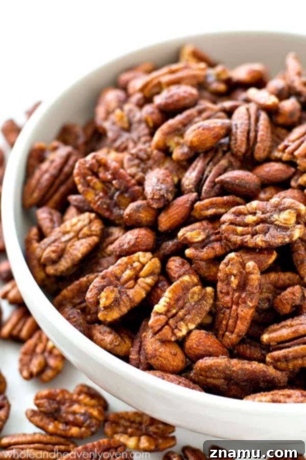 Maple-Kissed Spiced Pecans and Almonds 4 Roasted to perfection in maple syrup and spices, these candied pecans and almonds make the ultimate holiday snack or gift! @WholeHeavenly