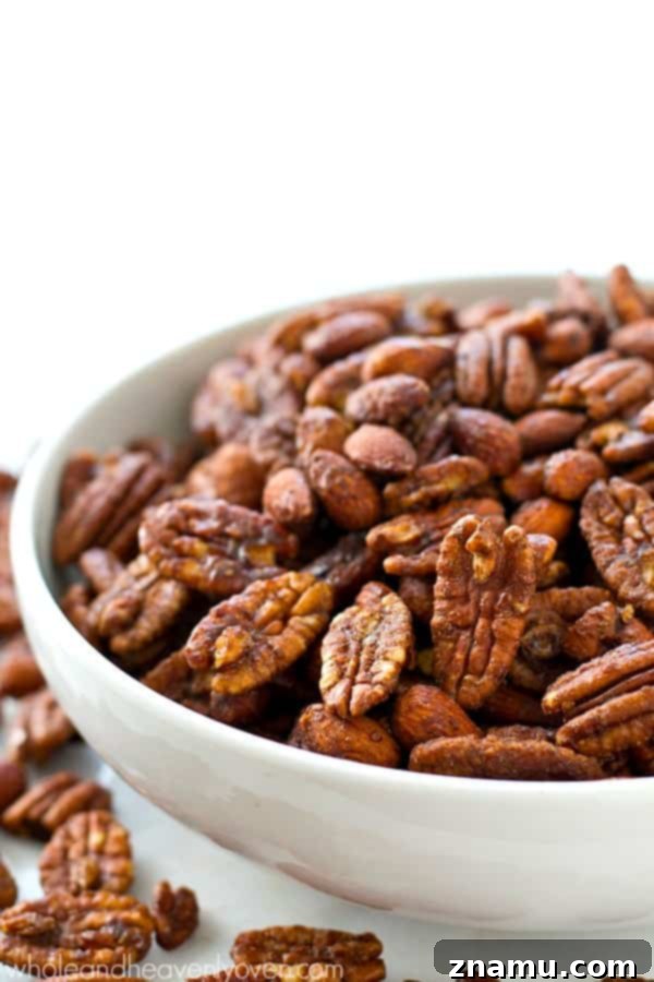 Maple-Kissed Spiced Pecans and Almonds 5 Roasted to perfection in maple syrup and spices, these candied pecans and almonds make the ultimate holiday snack or gift! @WholeHeavenly