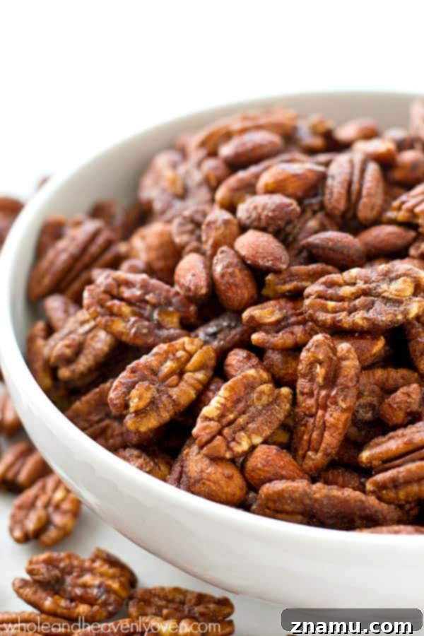 Maple-Kissed Spiced Pecans and Almonds 6 Roasted to perfection in maple syrup and spices, these candied pecans and almonds make the ultimate holiday snack or gift! @WholeHeavenly