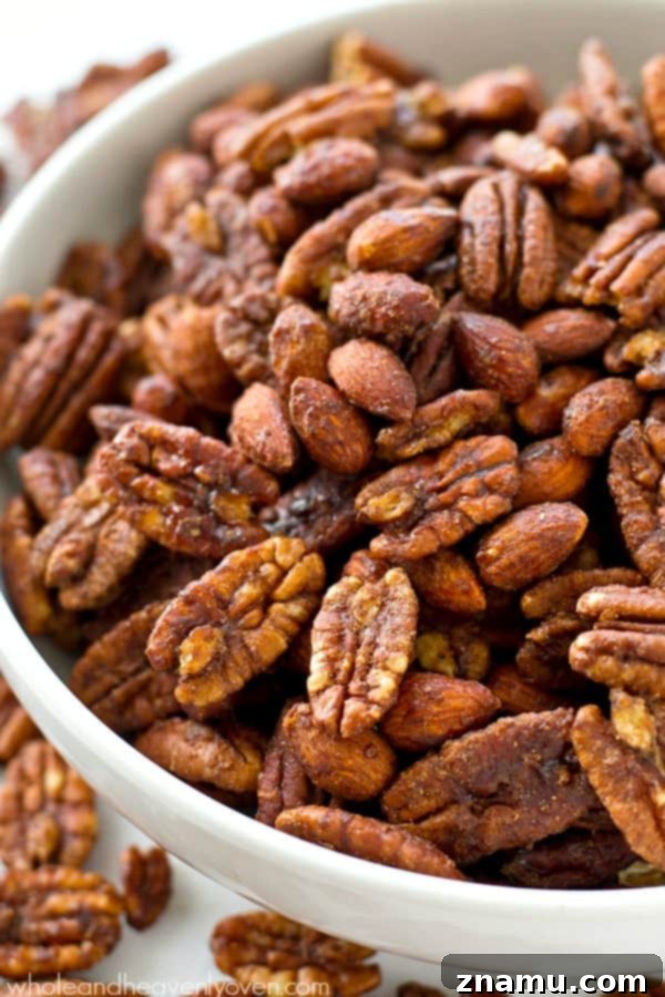 Maple-Kissed Spiced Pecans and Almonds 7 Roasted to perfection in maple syrup and spices, these candied pecans and almonds make the ultimate holiday snack or gift! @WholeHeavenly