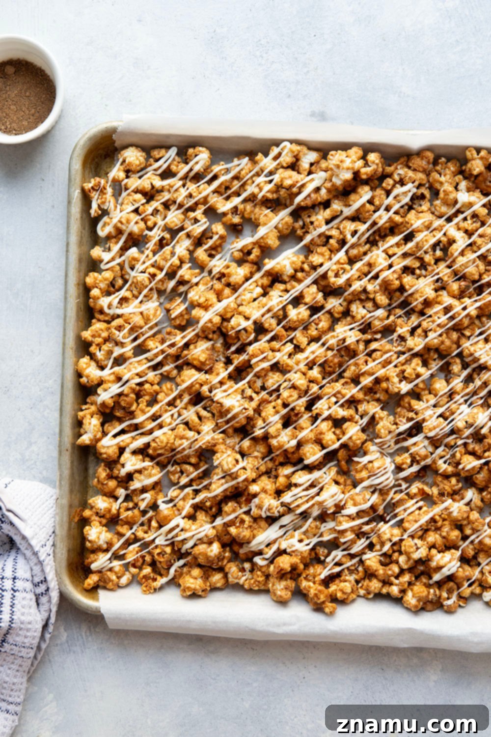 Gingerbread Caramel White Chocolate Crunch 5 Ingredients for gingerbread caramel popcorn, including spices, sugar, and popcorn kernels.