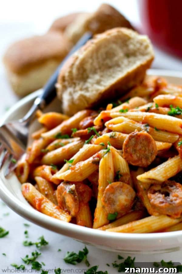 Effortless 30-Minute Penne Vodka with Sausage 4 Penne sausage alla vodka served in a bowl, showing the rich sauce, pasta, and sausage pieces, ready to be eaten.
