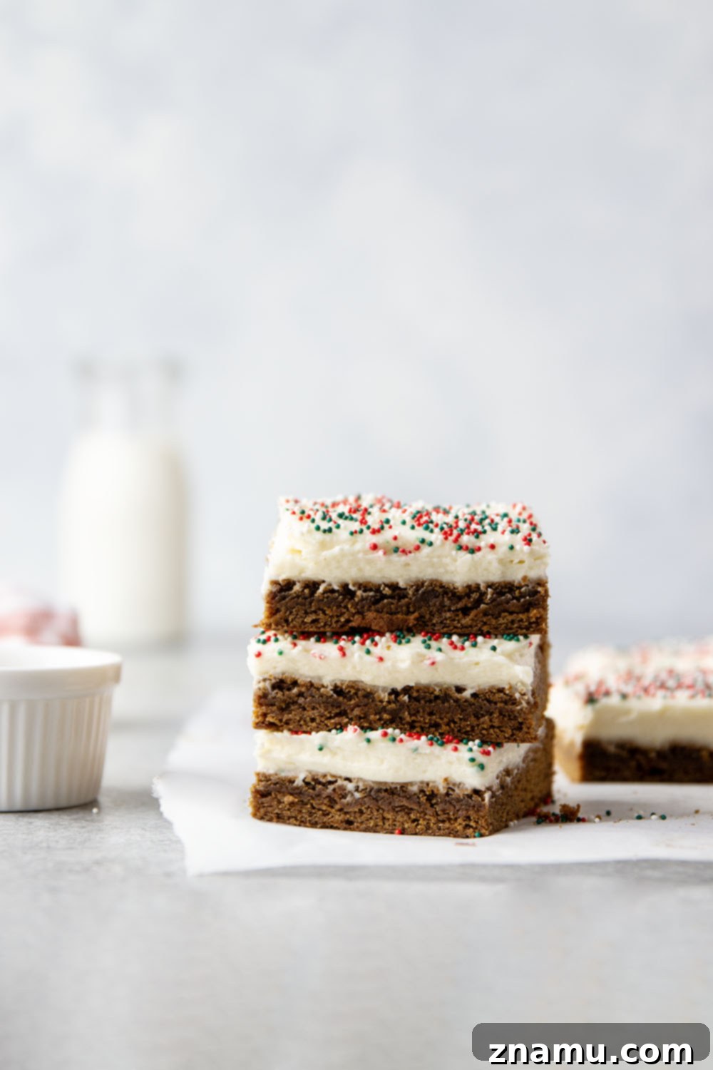 Chewy Ginger Spice Bars 2 These soft and chewy gingerbread cookie bars are topped with a rich cream cheese frosting and absolutely melt in your mouth!