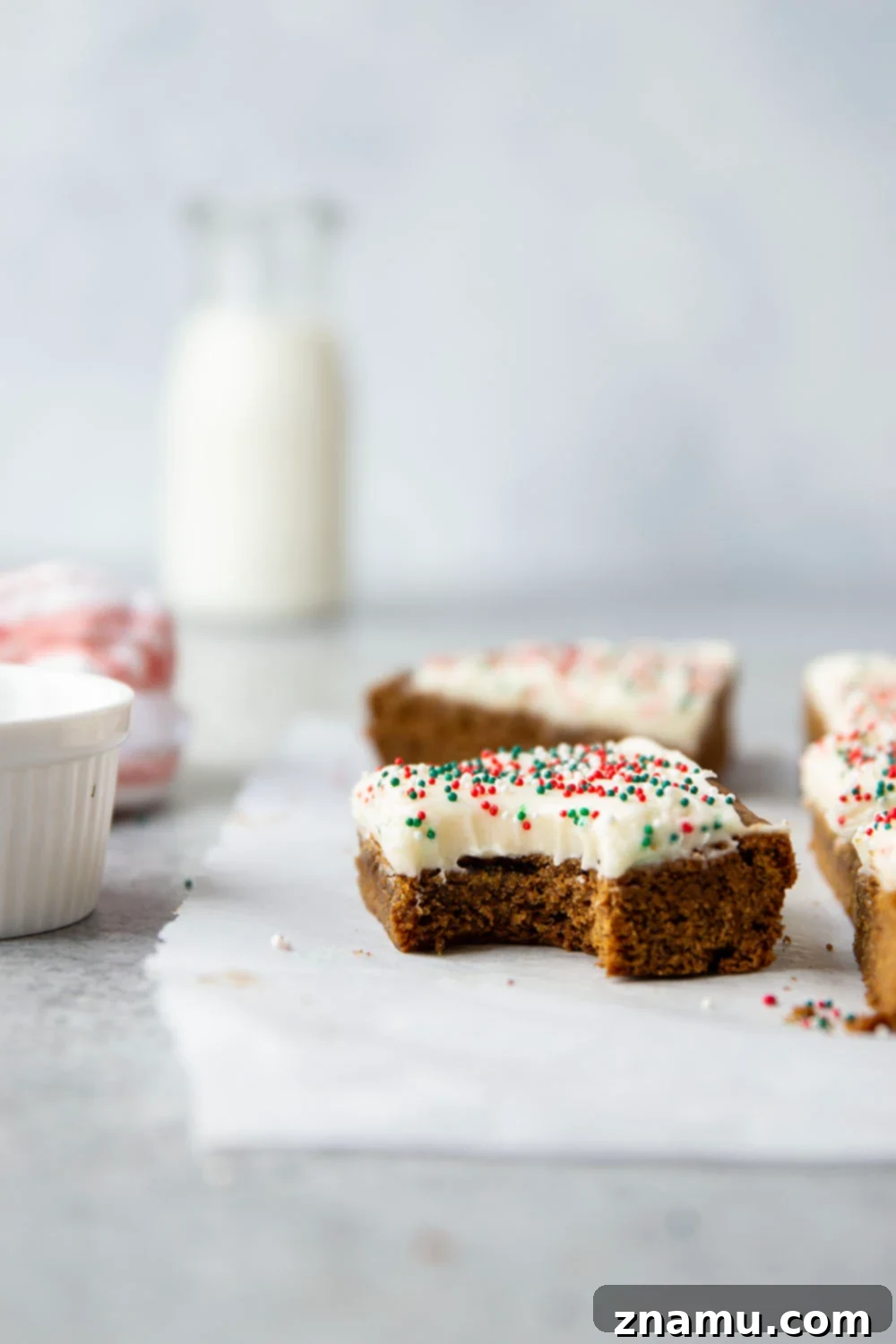 Chewy Ginger Spice Bars 5 These soft and chewy gingerbread cookie bars are topped with a rich cream cheese frosting and absolutely melt in your mouth!