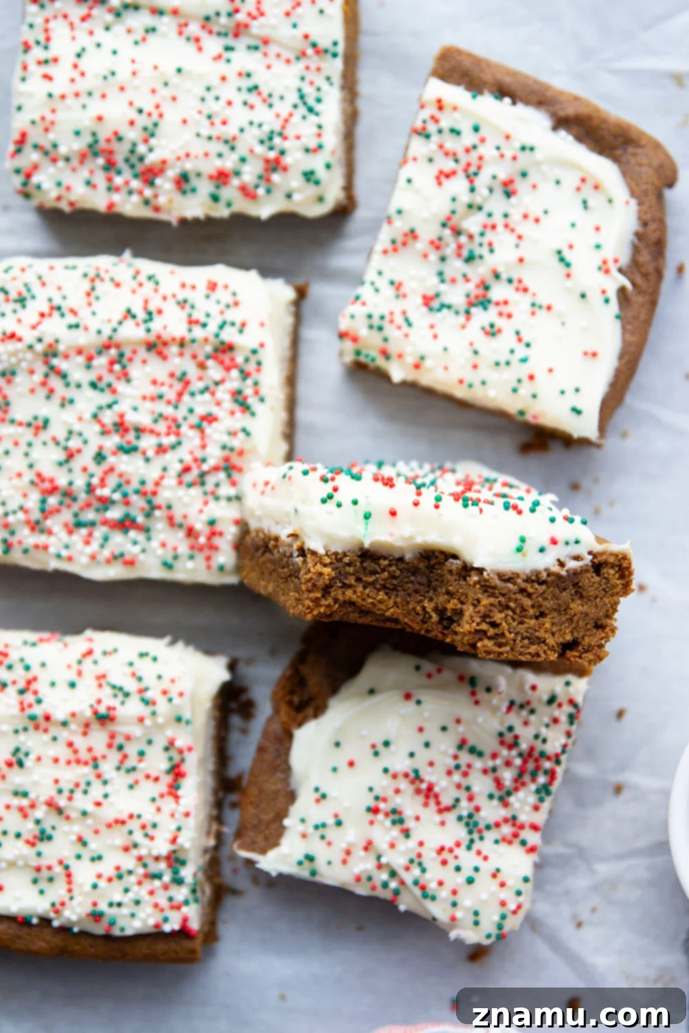 Chewy Ginger Spice Bars 6 These soft and chewy gingerbread cookie bars are topped with a rich cream cheese frosting and absolutely melt in your mouth!