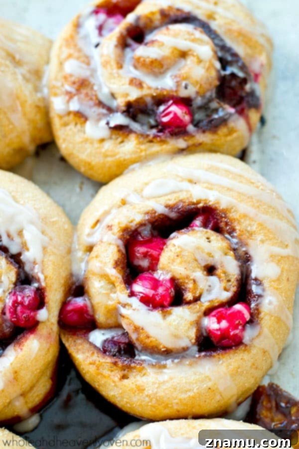 Dreamy Overnight Eggnog Cranberry Cinnamon Rolls 7 Glorious Eggnog Cranberry Cinnamon Rolls adorned with a thick, creamy eggnog icing
