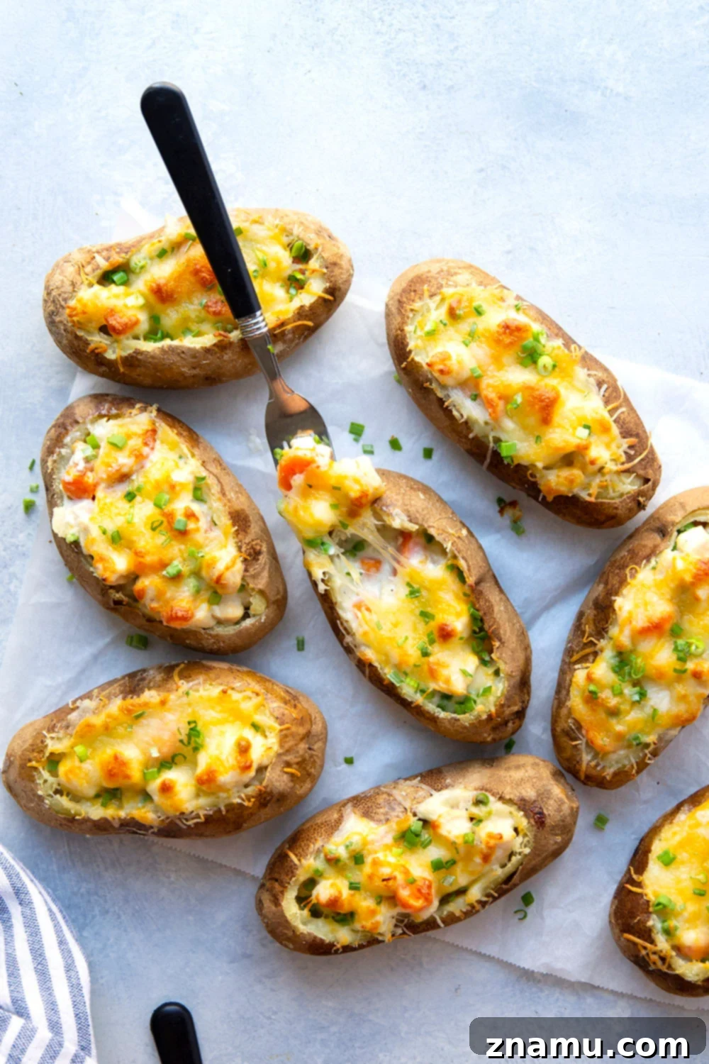 Loaded Chicken Pot Pie Potato Skins 2 Crispy chicken pot pie potato skins stuffed with creamy filling and cheese, perfect for a cozy meal.