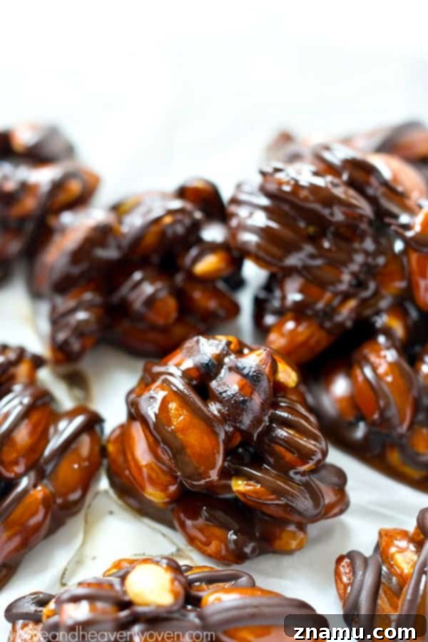 Almond Caramel Dark Chocolate Bites 2 Delicious Dark Chocolate Caramel Almond Clusters with roasted almonds, rich dark chocolate, and homemade caramel.