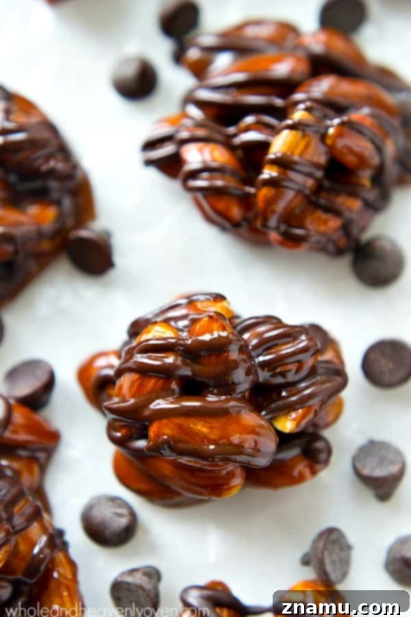 Almond Caramel Dark Chocolate Bites 3 Close-up of Dark Chocolate Caramel Almond Clusters on parchment paper, showcasing the rich caramel and dark chocolate.