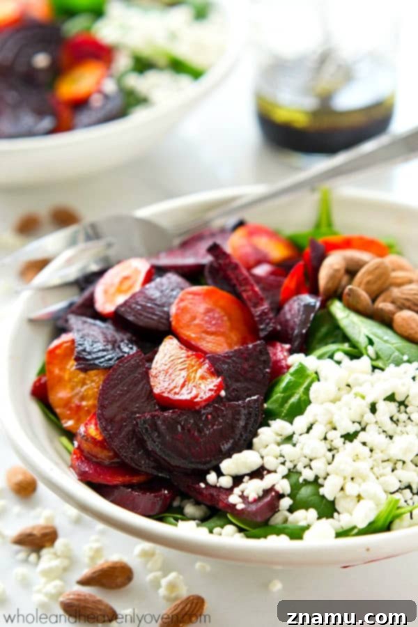 Vibrant Maple Roasted Root and Spinach Salad 2 Healthy spinach salad with roasted carrots and beets and maple vinaigrette