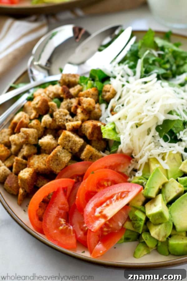 Bright Avocado Spinach Caesar with Tangy Buttermilk Dressing 6 Serving of Avocado Spinach Caesar Salad garnished with fresh Parmesan and a drizzle of dressing