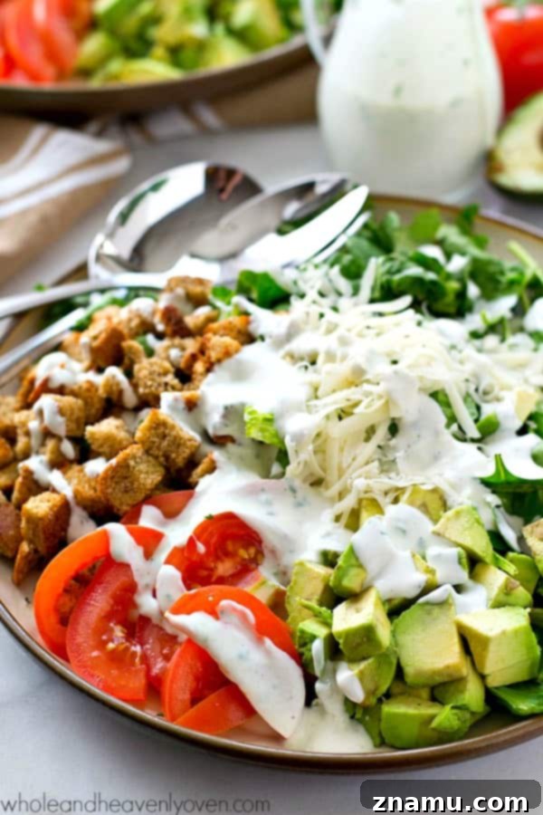 Bright Avocado Spinach Caesar with Tangy Buttermilk Dressing 7 A beautifully presented bowl of Avocado Spinach Caesar Salad, perfect for a healthy meal