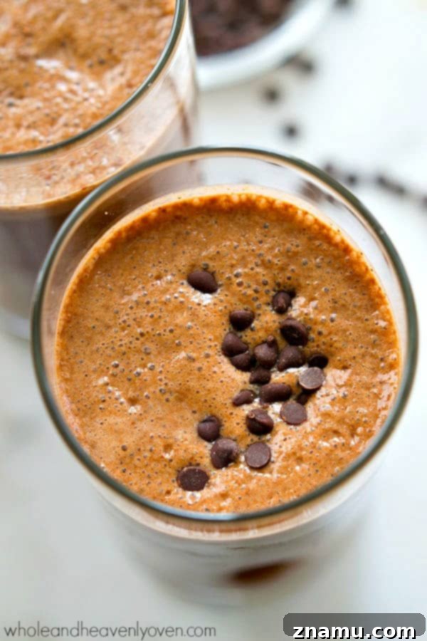 Rise and Shine Mocha Smoothie 3 A refreshing and healthy cafe mocha smoothie served in a glass, with a hint of chocolate.