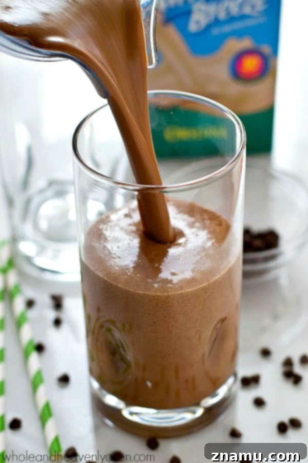 Rise and Shine Mocha Smoothie 6 Close-up of a creamy Cafe Mocha Breakfast Smoothie in a glass, ready to be enjoyed.