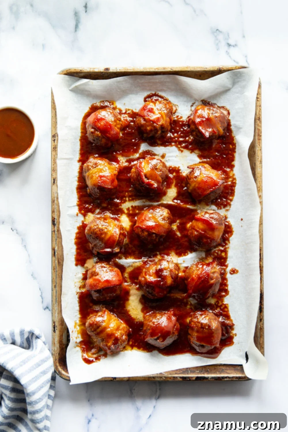 Sweet & Smoky Bacon BBQ Turkey Meatballs 3 Juicy BBQ turkey meatballs are wrapped in bacon and baked in a sweet and tangy brown sugar barbecue sauce for the best 2-bite appetizer!