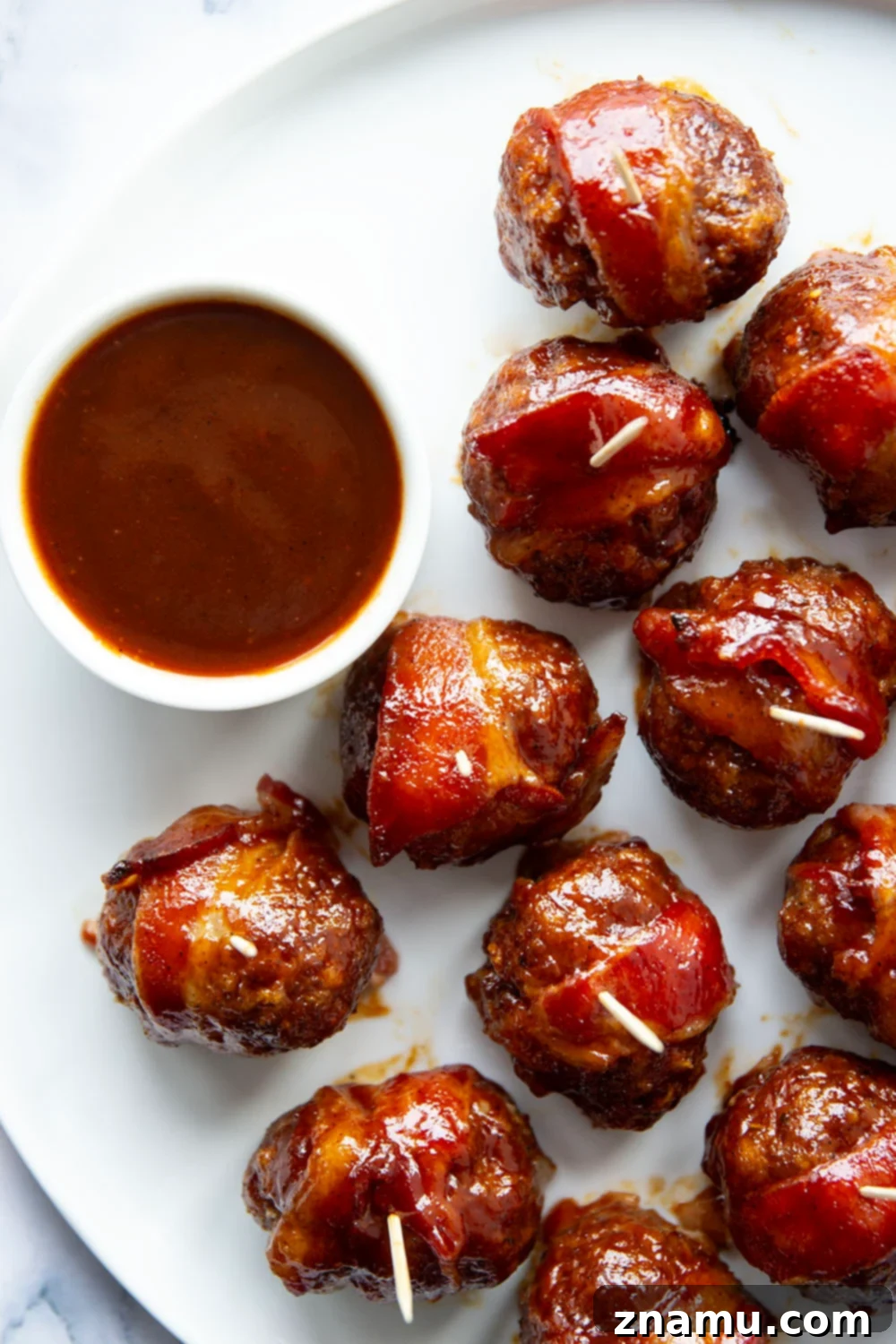 Sweet & Smoky Bacon BBQ Turkey Meatballs 4 Juicy BBQ turkey meatballs are wrapped in bacon and baked in a sweet and tangy brown sugar barbecue sauce for the best 2-bite appetizer!
