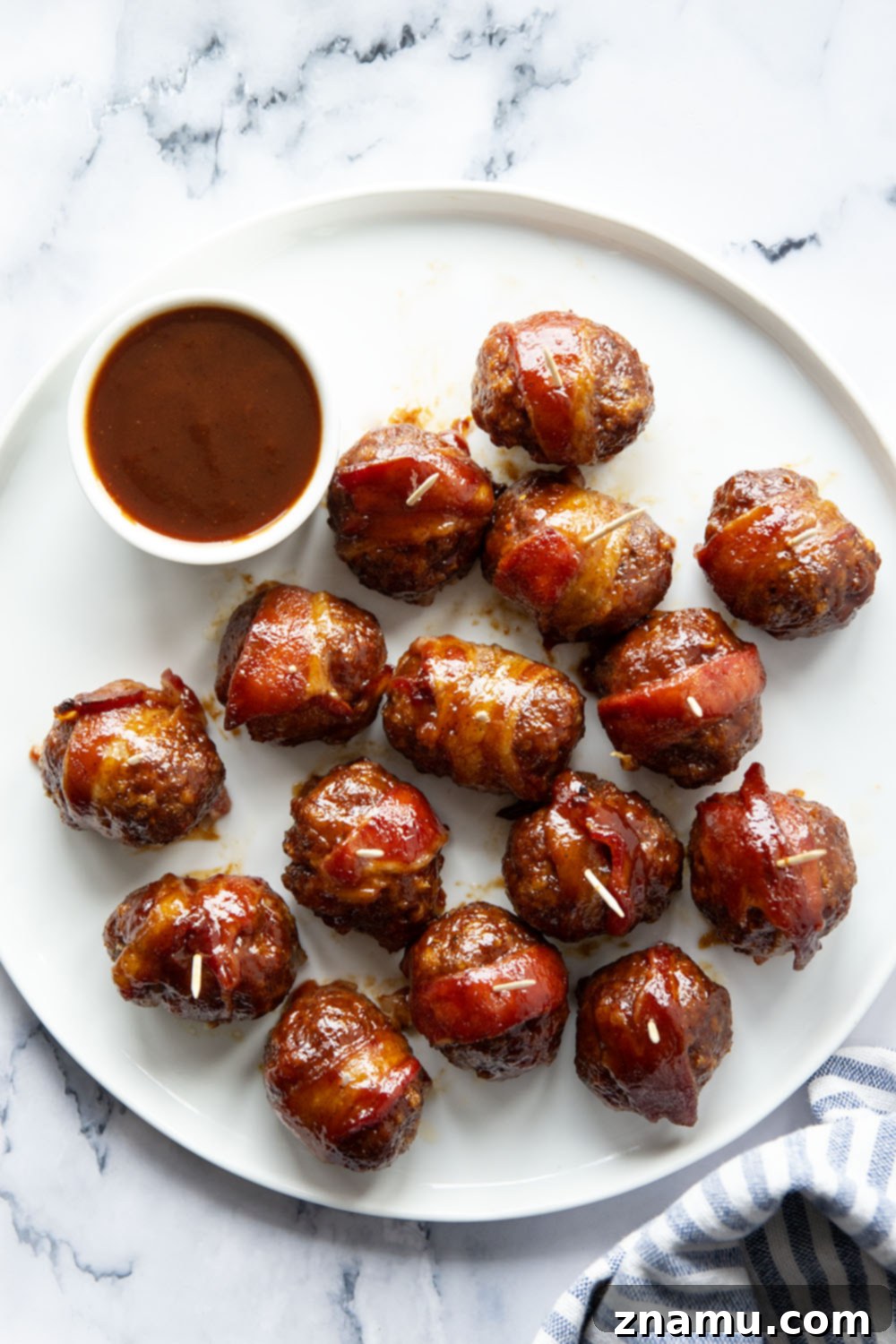 Sweet & Smoky Bacon BBQ Turkey Meatballs 6 Juicy BBQ turkey meatballs are wrapped in bacon and baked in a sweet and tangy brown sugar barbecue sauce for the best 2-bite appetizer!