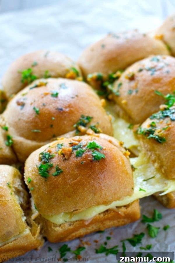 Ultimate Garlic Butter Monte Cristo Pull-Apart Sliders 4 A tray of freshly baked Monte Cristo Sliders, ready to be pulled apart and served.
