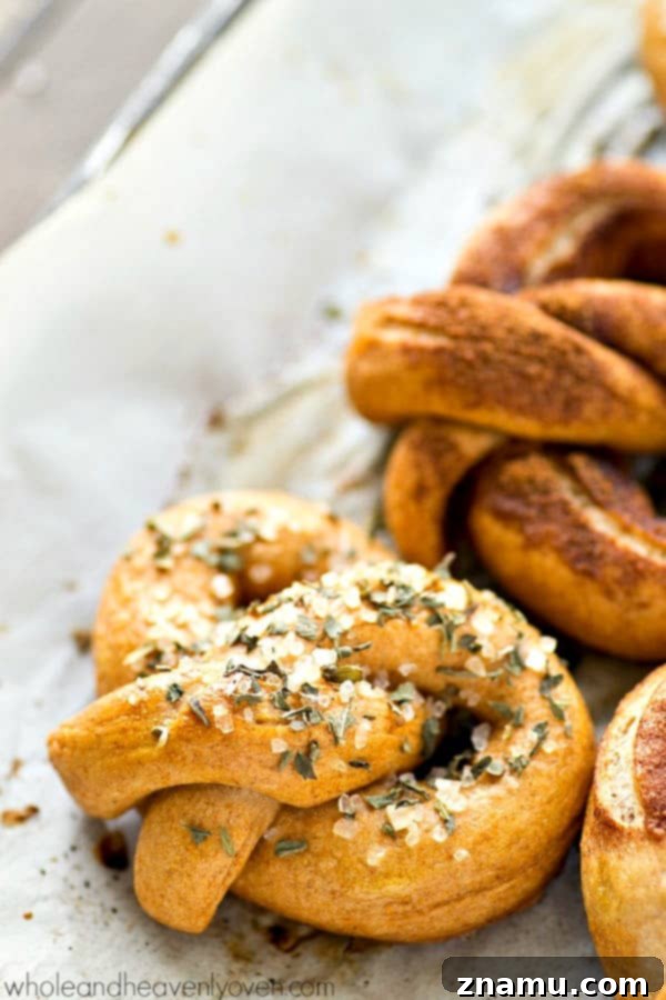Unlock the World of Perfect Soft Pretzels 2 Deliciously golden-brown homemade soft pretzels ready to be enjoyed.
