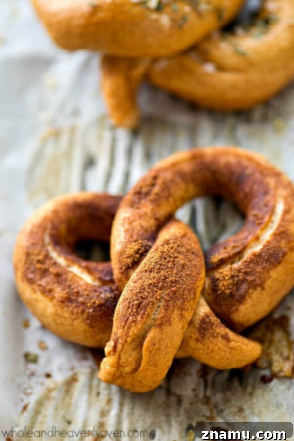 Unlock the World of Perfect Soft Pretzels 8 A close-up shot of a single, perfectly golden soft pretzel, highlighting its texture.