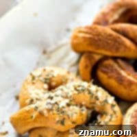 Golden soft pretzels, some sprinkled with cinnamon sugar, others with savory salt.