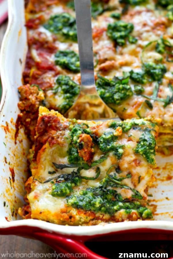 Triple Cheese Pesto Turkey Bake 4 A full baking dish of uncooked turkey pesto lasagna, ready for the oven with a layer of cheese on top