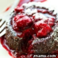 Exploding with a warm, gooey chocolate filling, and covered in a tangy raspberry sauce, these stunning chocolate lava cakes are the perfect treat for you and your sweetheart!