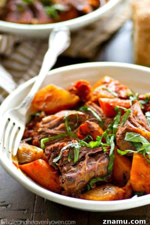 Tender Italian-style pot roast with root vegetables in a slow cooker, a healthy comfort food classic.