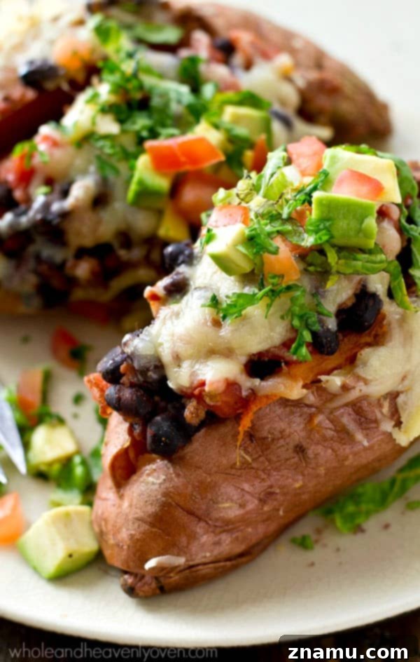 Fiesta Loaded Sweet Potato Shells 5 Overhead shot of freshly cooked sweet potatoes with a variety of taco toppings