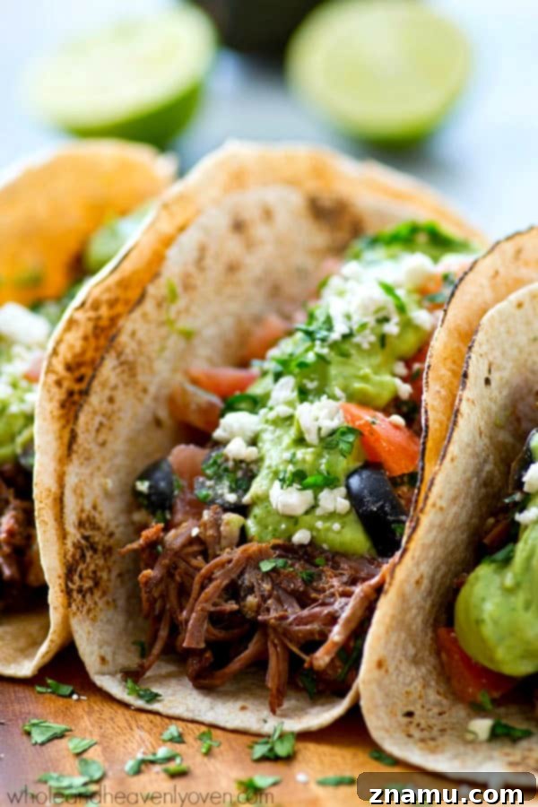 Chipotle Pulled Beef Tacos with Greek Salsa Avocado Crema 2 Flavorful Chipotle Crockpot Beef Tacos with Fresh Greek Salsa and Creamy Avocado Crema