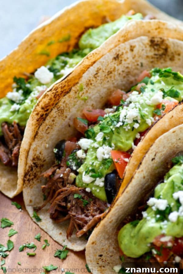 Chipotle Pulled Beef Tacos with Greek Salsa Avocado Crema 3 Slow Cooker Chipotle Beef Tacos topped with a vibrant Greek Salsa