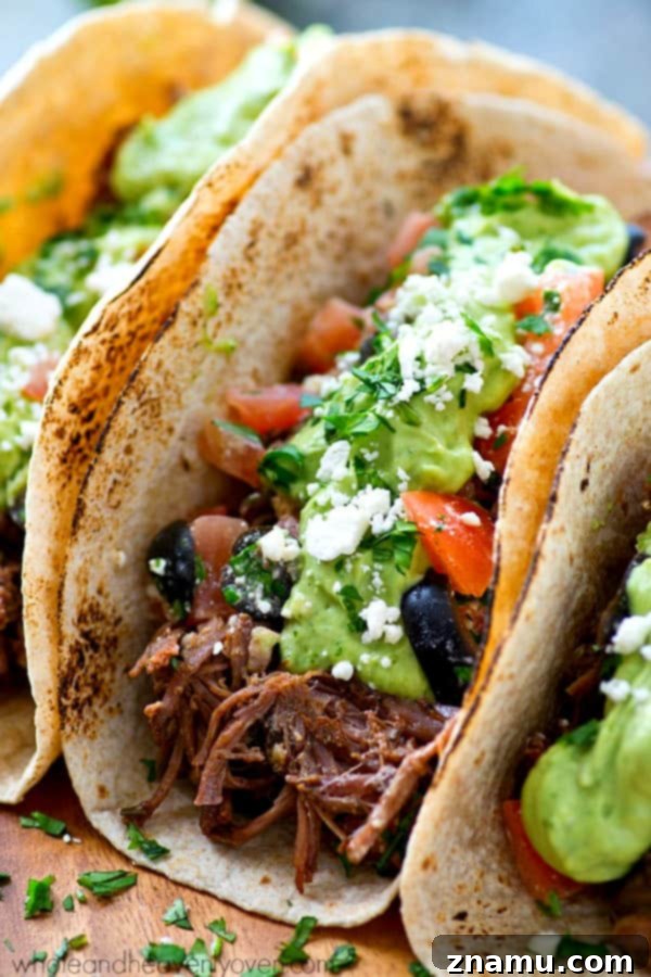 Chipotle Pulled Beef Tacos with Greek Salsa Avocado Crema 4 Homemade Chipotle Pulled Beef Tacos with unique Greek-inspired toppings