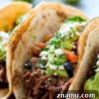 Chipotle Pulled Beef Tacos with Greek Salsa Avocado Crema 9 Chipotle Pulled Beef Tacos with Greek Salsa + Avocado Crema
