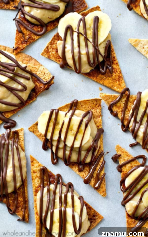 Banana Cream Pie Nacho Platter 2 Delicious Banana Cream Pie Dessert Nachos piled high with fresh bananas, creamy pudding, and chocolate drizzle.