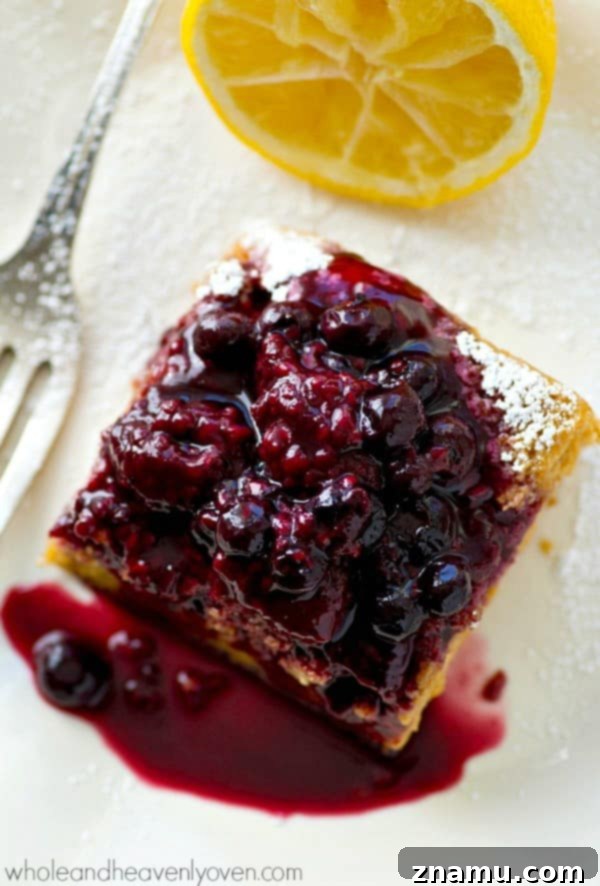 Zesty Lemon & Berry Dream Bars 2 Lusciously silky and moist inside and loaded with tons of citrus flavors, these magic cake bars are going to completely blow you away.---Don't forget the warm berry sauce on top!